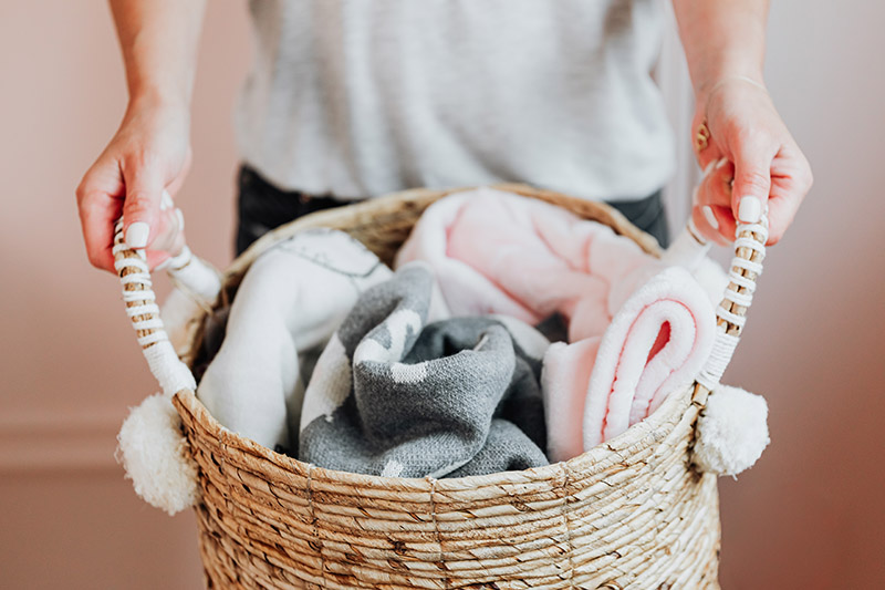 baby blankets folded in a basket