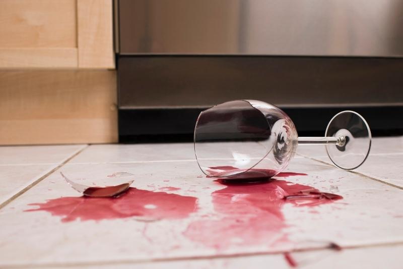 broken wine glass on the floor