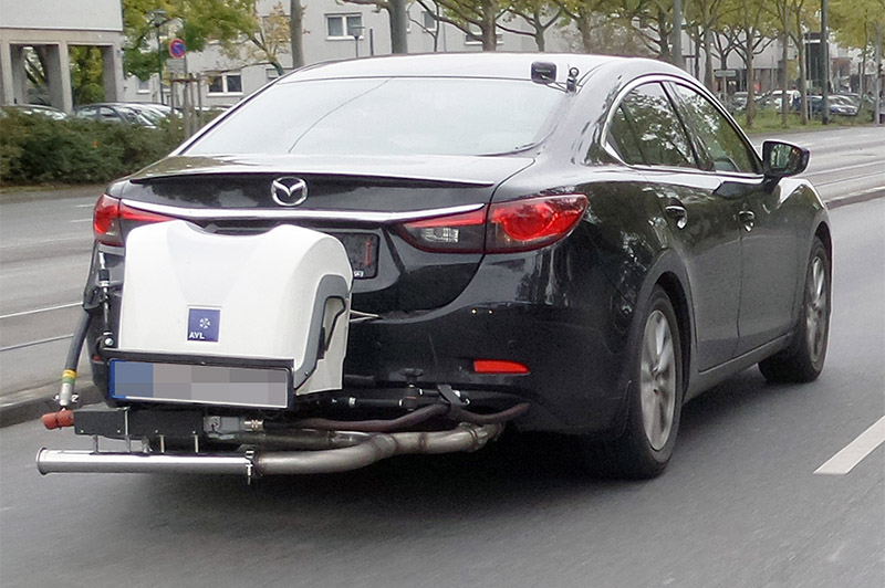 a black car with an emission testing system
