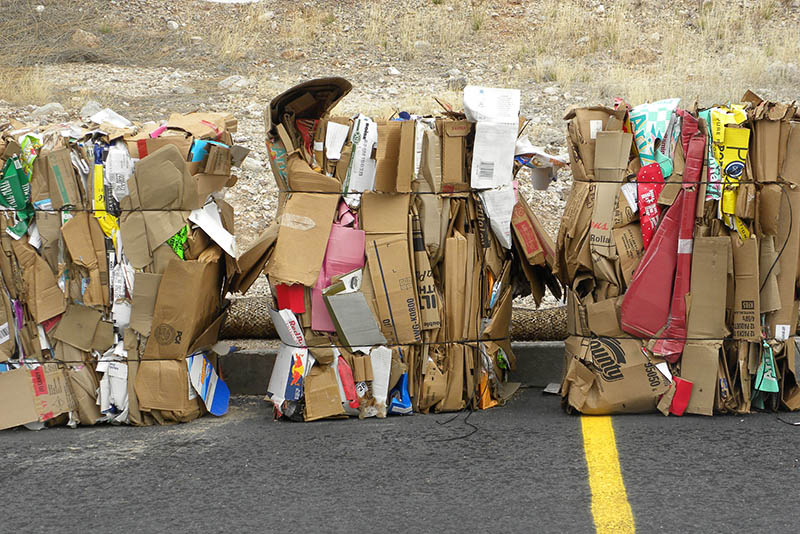 cardboard boxes flattened and stored for recycling