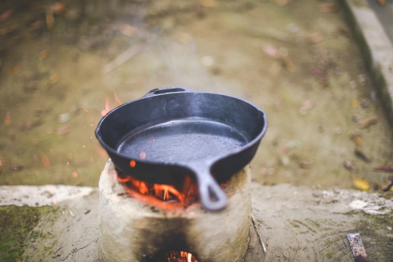 cast iron pan over open fire