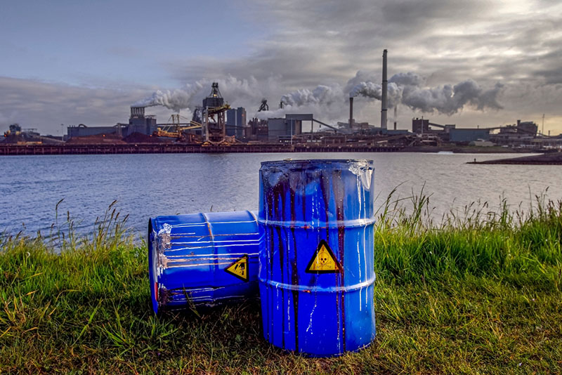 chemical waste barrels on the ground