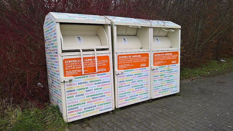 3 clothing recycling containers on the street