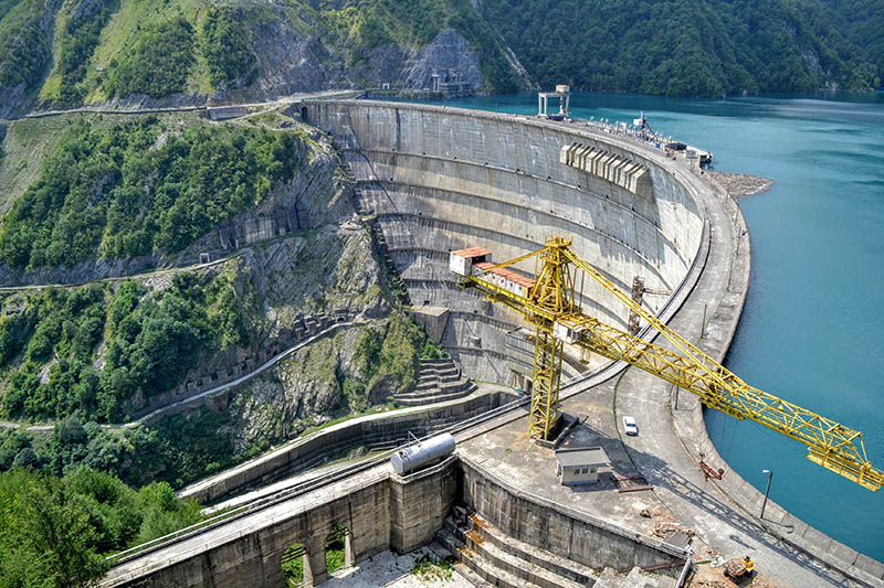 construction site with a crane on a water dam