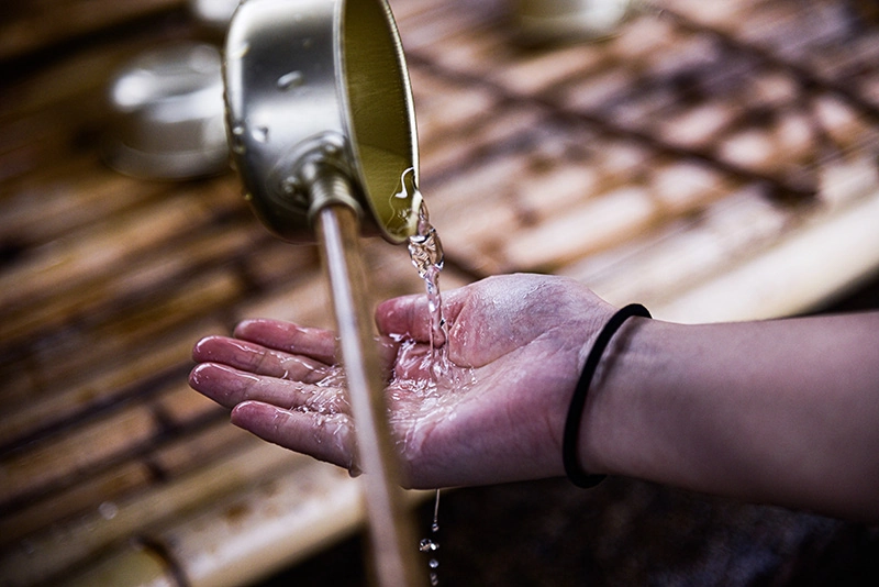 clean water pouring onto a person's hand