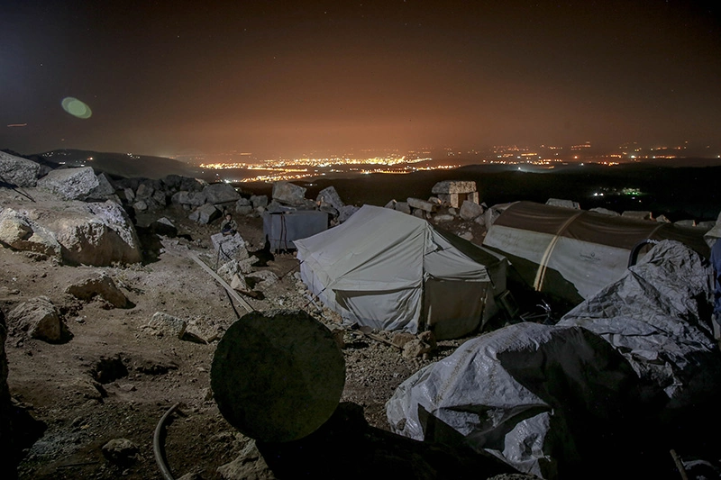 Tents for homeless people nearby the city