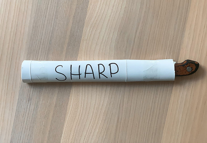kitchen knife wrapped in paper