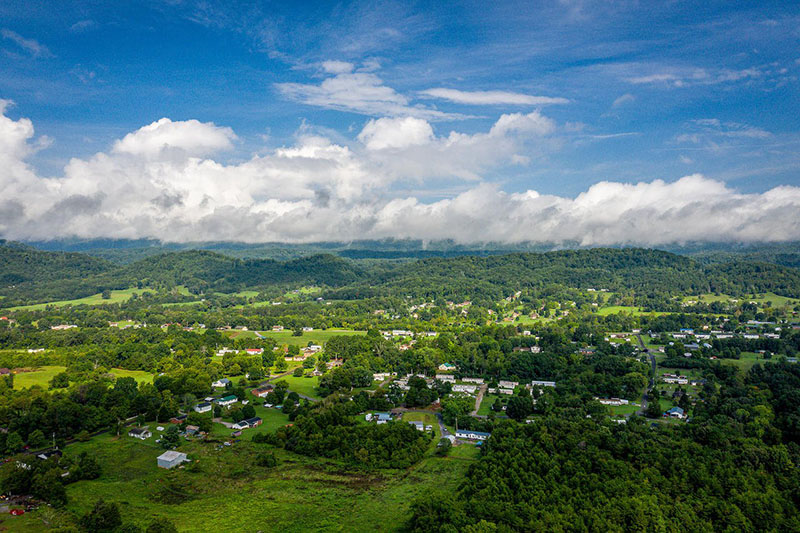 an aerial view of the low-density housing placed between large farms