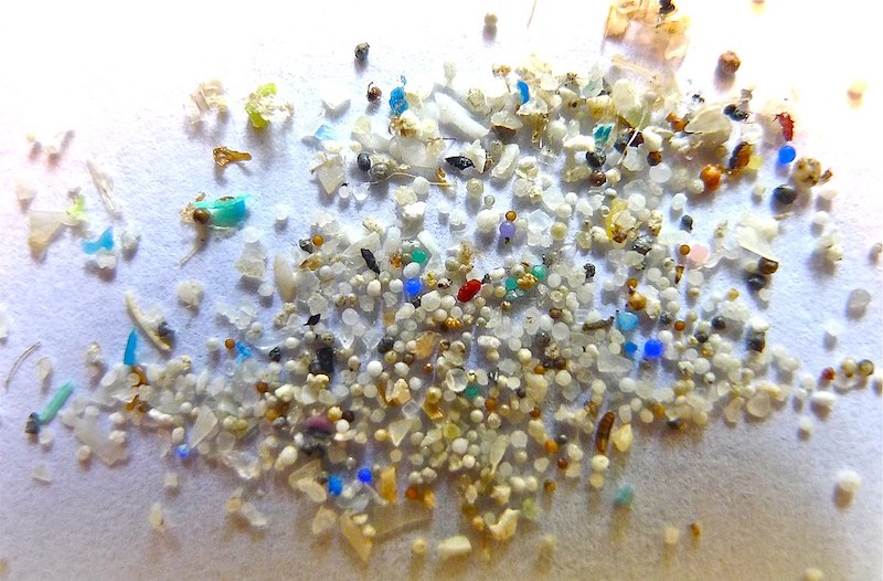 pieces of microplastic on a white surface