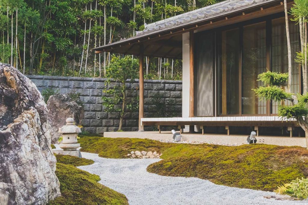 a wooden house with moss lawn