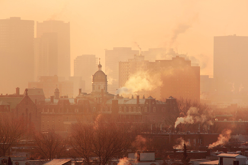 an orange haze over the city skyline