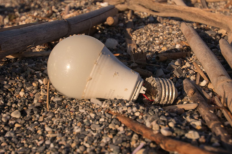old broken light bulb on the ground