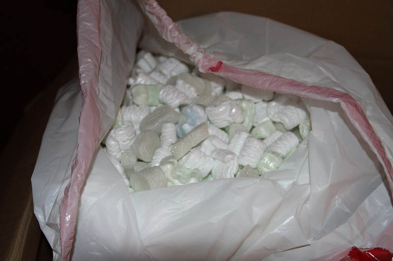 packaging peanuts inside a white trash bag