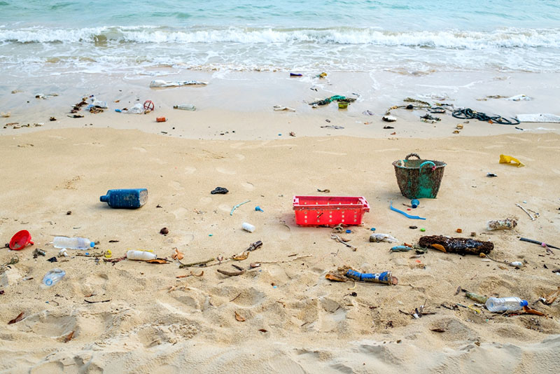 beach polluted with plastic waste