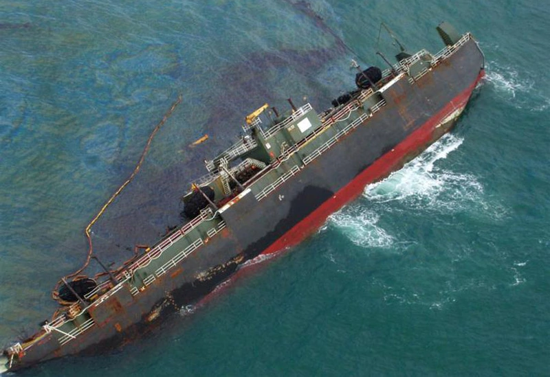 oil spill around a sinking ship