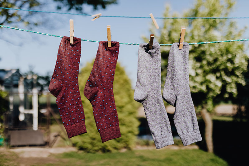 socks air drying on a rope outside