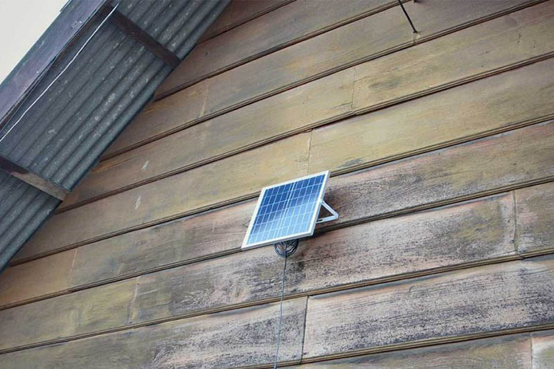 small solar panel mounted on a building exterior