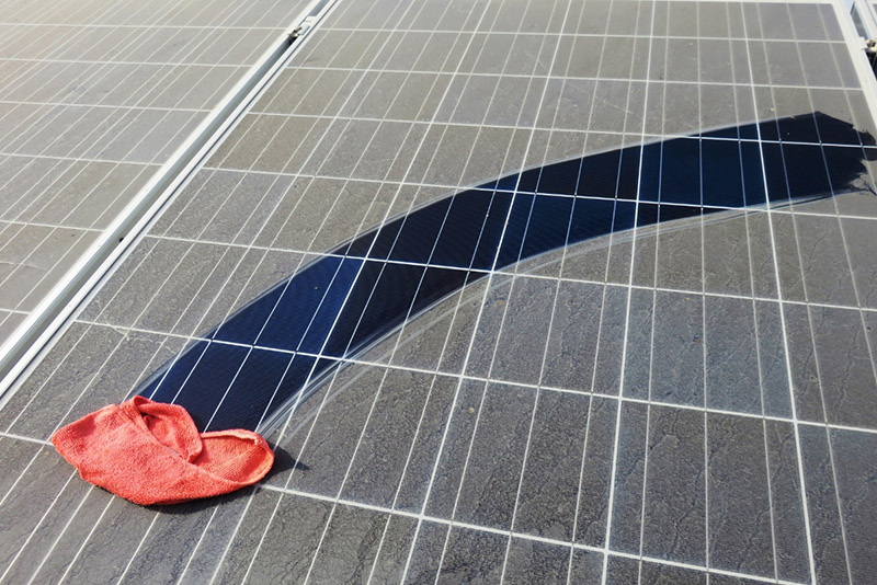 wet towel on a dusty solar panel