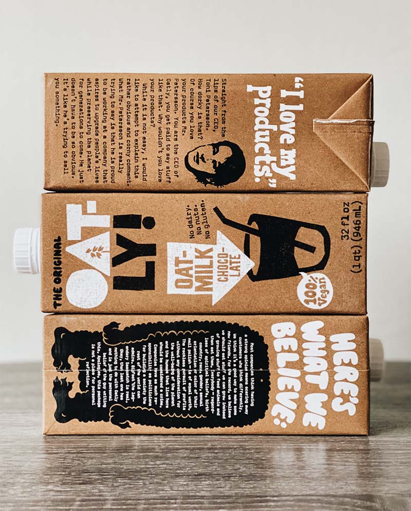 three milk cartons stacked on one another