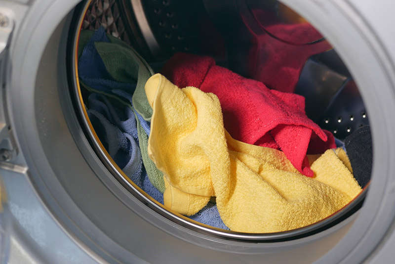 colorful towels inside a washing machine