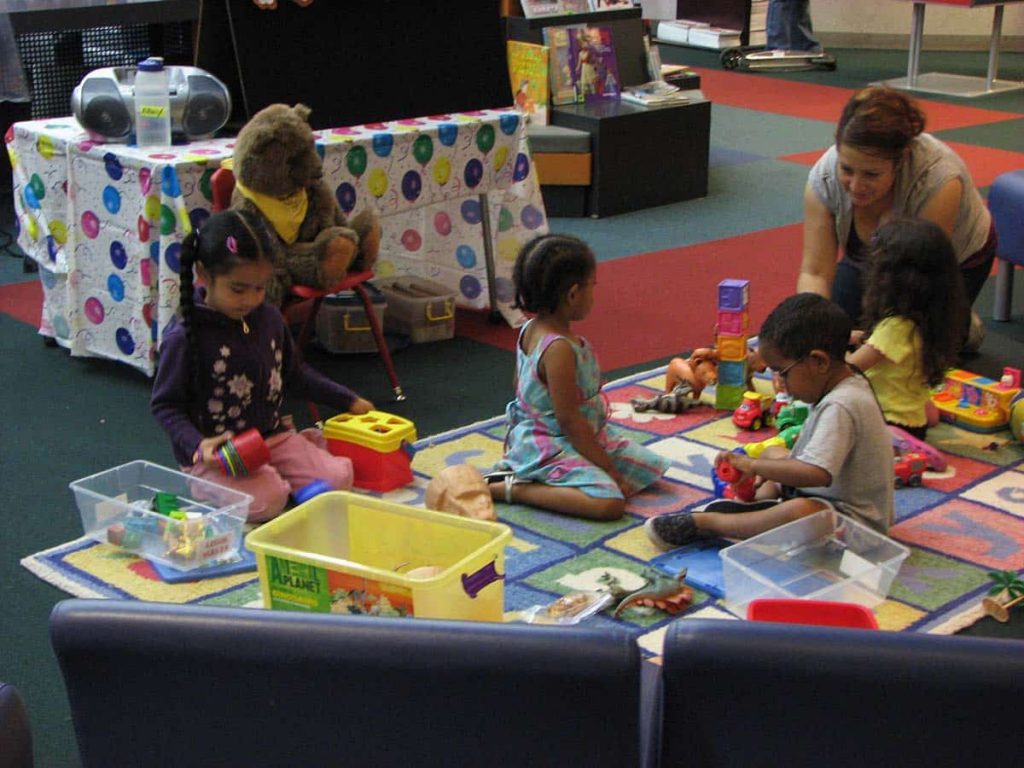 Children playing in a toy libabrary