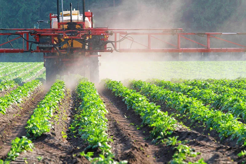 tractor spraying pesticides