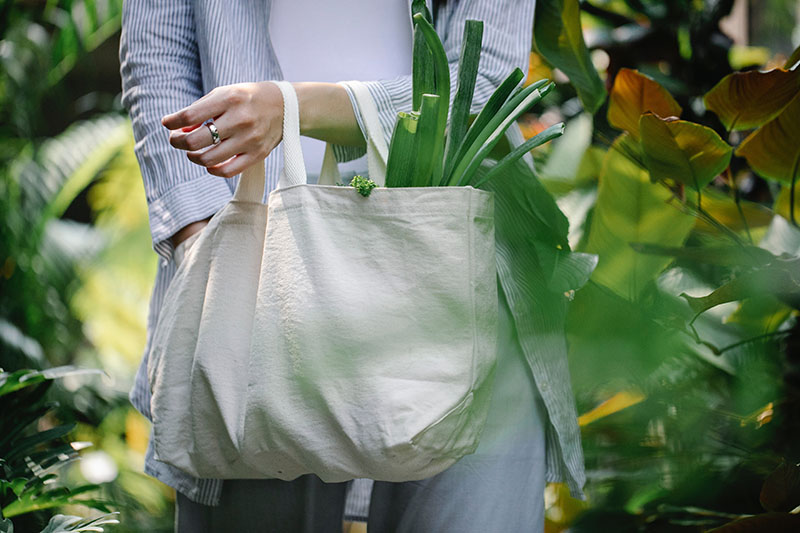 woman holding textile shopping bag