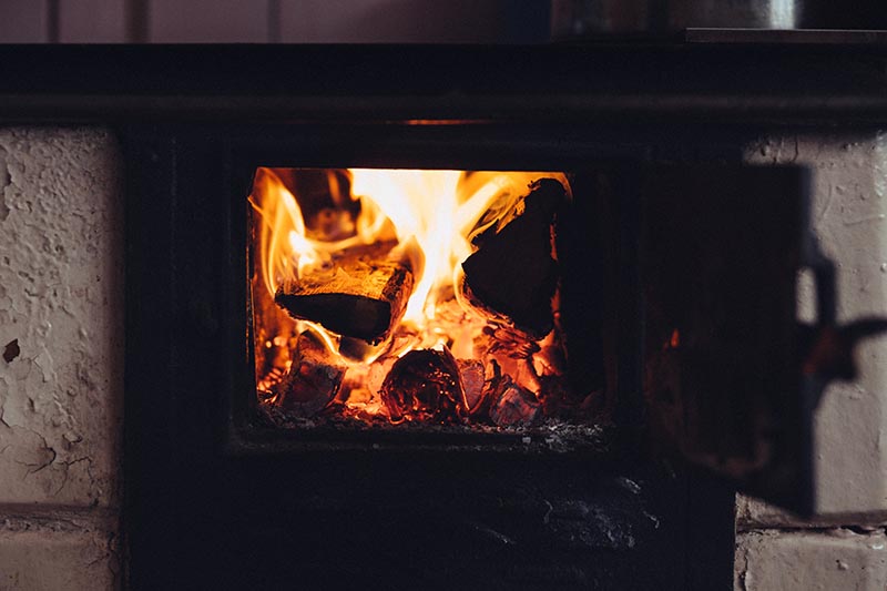 firewood logs burning in a wood burner